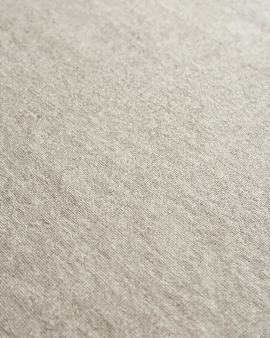 Close detail study of textile fabric surface during finishing work in progress, soft directional daylight, restrained na